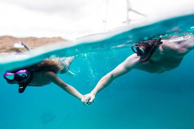 Waikiki Couples Snorkel Retreat - Cruising past surfers and Diamond Head Crater